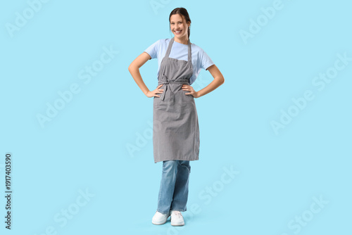 Happy young female barista ...