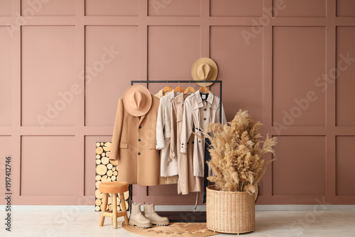 Coat rack with hats and pam...