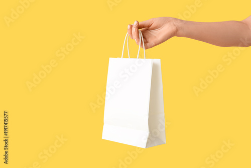 Female hand with paper shop...