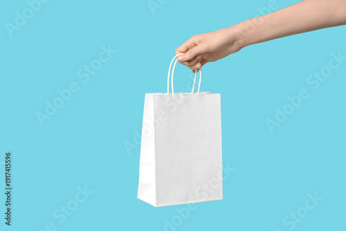 Female hand with paper shop...