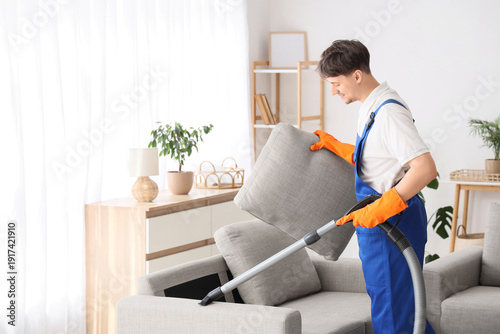 Young male janitor with mod...