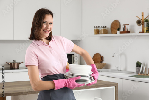 Young woman with pink glove...