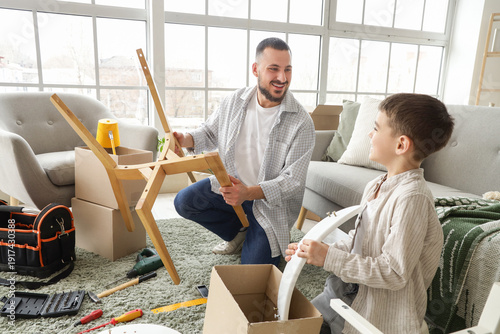 Father with his son assembl...