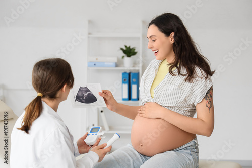 Young pregnant woman and do...
