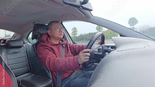 A male driver’s tired and dozing off from long hours of driving.