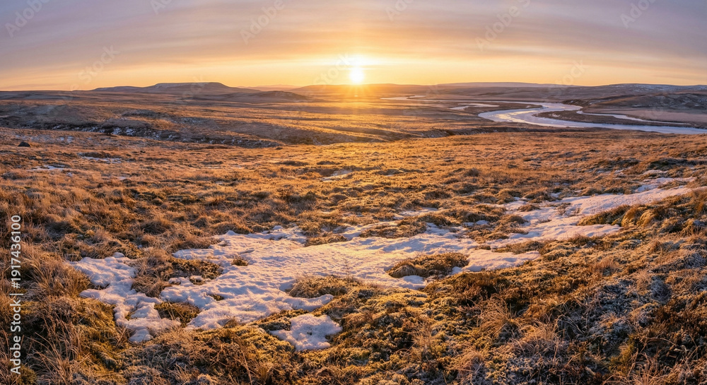 Obraz premium Golden sunlight stretching across remote tundra landscape