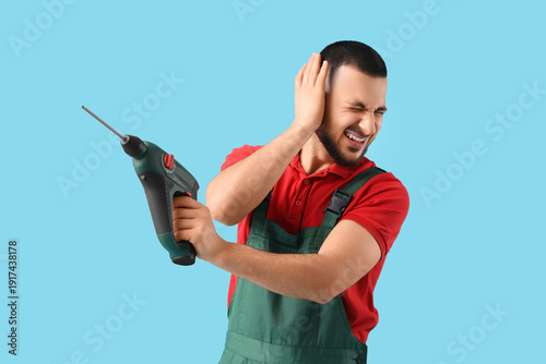 Male worker with drill suff...
