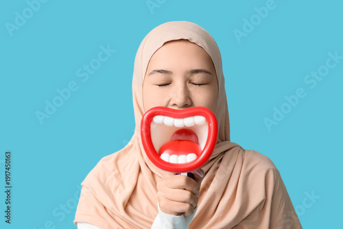 Young Asian Muslim woman wi...