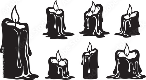 Set of black candles with melting wax and flames