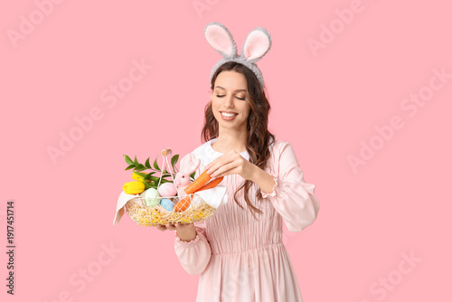 Happy young woman in bunny ...