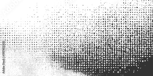 Black and white halftone dot pattern fading from dense to sparse