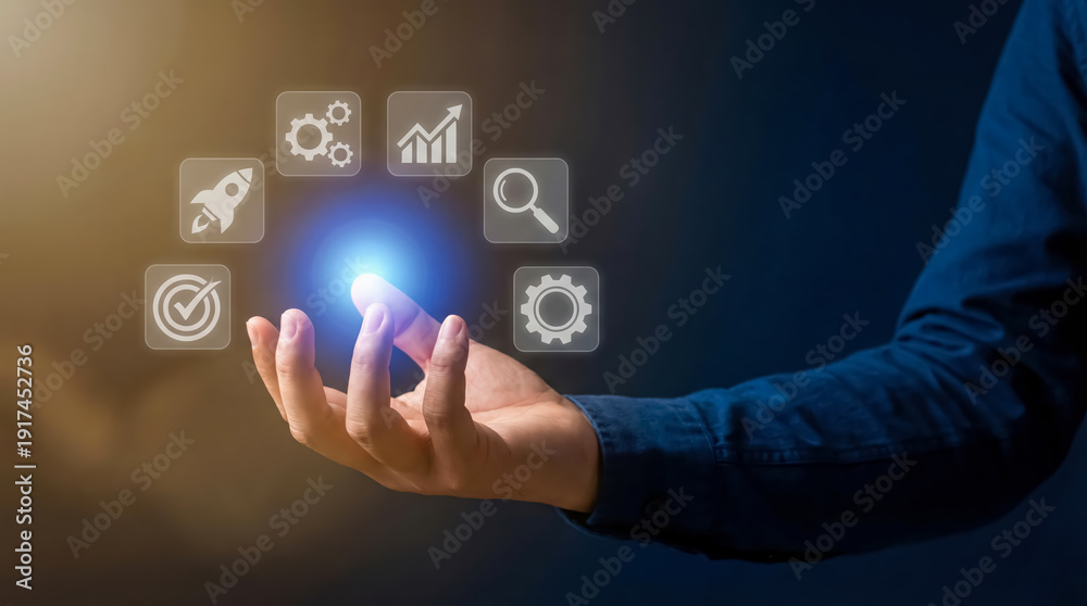 Fototapeta premium Businessman holding hand with glowing icons floating above palm in air