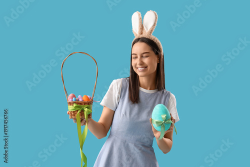 Young woman in bunny ears w...