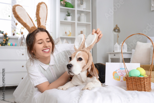 Young woman with Beagle dog...