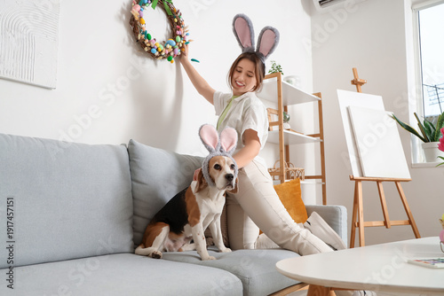 Young woman with Beagle dog...