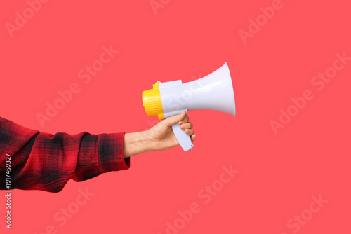 Female hand with megaphone ...
