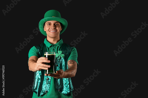 Happy young man in green cl...