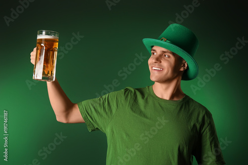 Young man with mug of beer ...