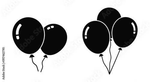 A cluster of black balloons tied with strings a dark silhouette