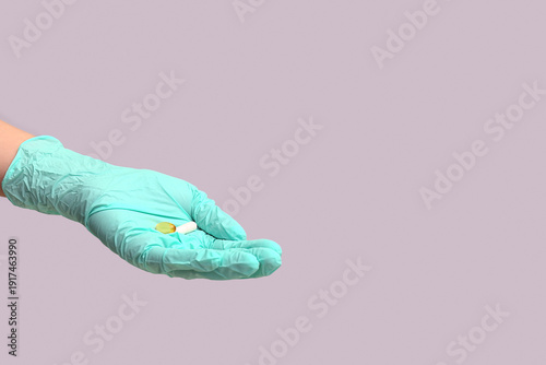 Hand of doctor in turquoise...