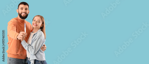 Happy young couple with pre...