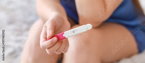 Young woman with pregnancy ...