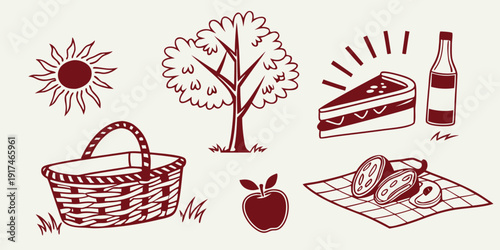 A delightful assortment of picnic items including a basket, sandwiches, and a bottle.