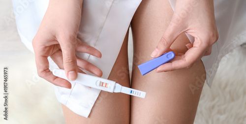 Woman with pregnancy test, ...