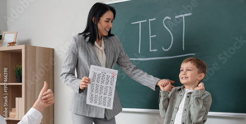 Happy schoolboy and teacher...