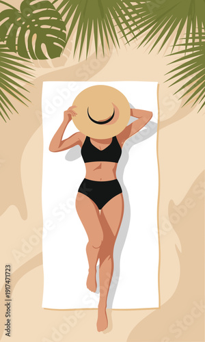 A woman in a black swimsuit and straw hat lies sunbathing on a white towel at the beach