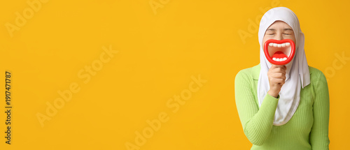 Young Asian Muslim woman wi...