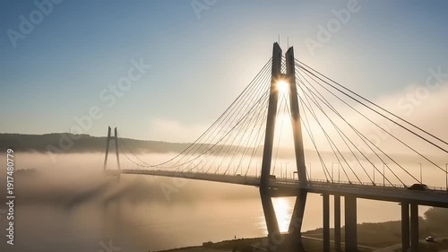 Cable Stay Bridge with Foggy Landscape at Sunrise.