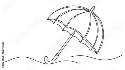 Elegant umbrella standing alone on windy beach