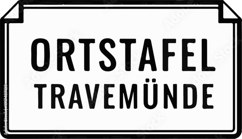 Black and white sign indicating "ORTSTAFEL TRAVEMÜNDE" with a folded corner effect