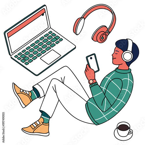 A man sitting with a laptop and headphones
