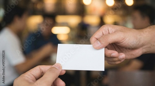 A businessman holding a blank business card in his hand ready for advertisement or contact information