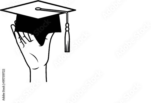 Hand holding a graduation cap with a tassel