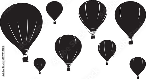 Black hot air balloons floating in the white sky
