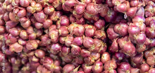 Shallots, Fresh red shallots piled together, vibrant purple tones and rich texture. Ideal for food, agriculture, market, natural ingredient, and background concepts