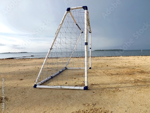 A goalpost on the beach. Football can be played anywhere.