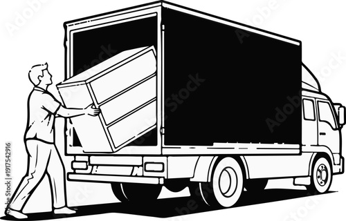 Person loading a dresser into the back of a large truck for transport