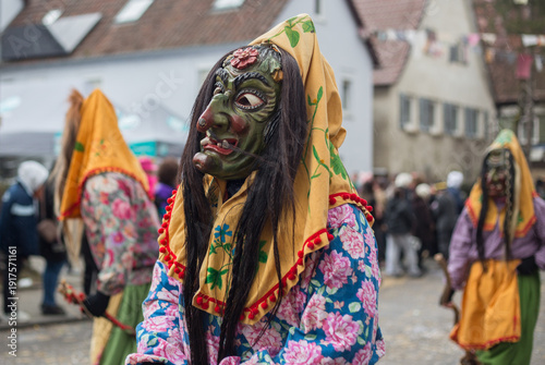 Traditional witch costume with scary wooden masks during the Swabian-Alemannic carnival (