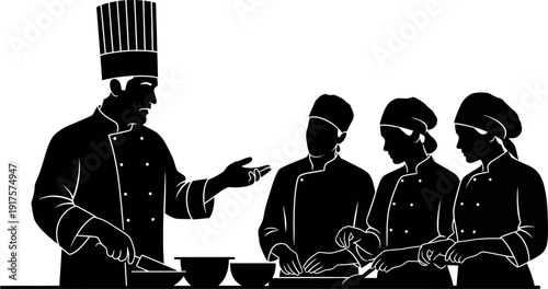 Executive chef instructing a group of culinary students in a kitchen