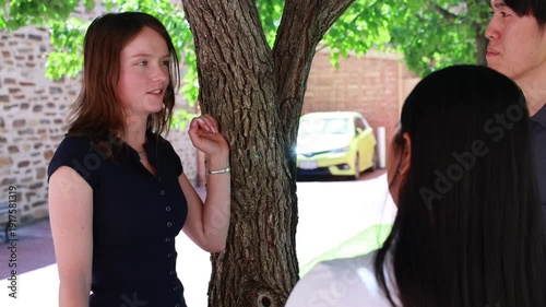Multicultural University Students Talking Together in a Park