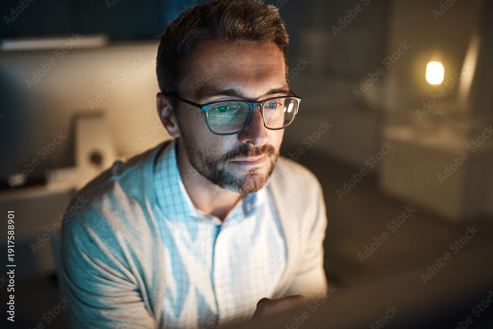 Obraz premium Reading, computer and glasses with business man in office for planning, night and it web system. Overtime, research and project manager with employee in tech agency for operations launch or developer