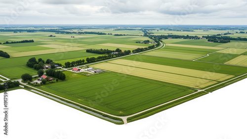 Aerial view of lush green farmland with roads and buildings