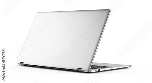 Silver laptop computer open on white surface