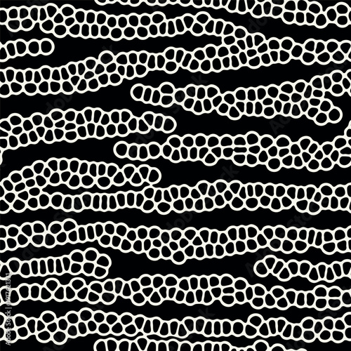 Vector seamless pattern. Modern spotted texture. Repeating abstract dotted background. Graphic diagonal wavy stripes. Can be used as a swatch in Illustrator.