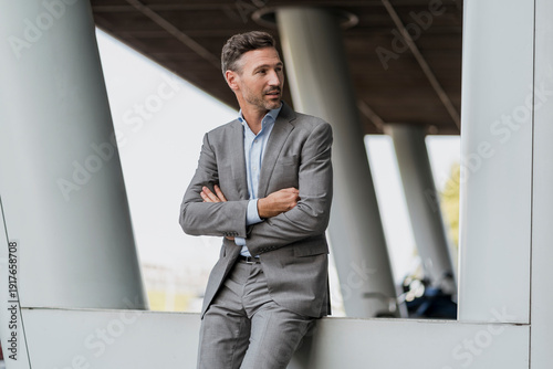 Portrait of confident businessman outdoors looking sideways