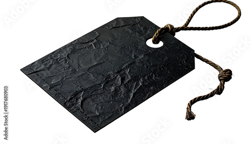 Dark, textured tag with rope on a black background